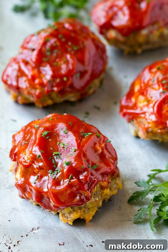 Easy Individual Meatloaf Recipe: Perfect for Family Dinners A tray of beautifully arranged individual cheeseburger meatloaves, ready to be served or enjoyed as leftovers.