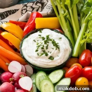 Make your own wholesome ranch dip from scratch, skipping the MSG and preservatives found in store-bought versions. Served with fresh vegetables.