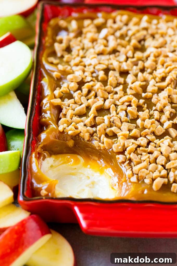 Close-up of caramel apple dip highlighting the perfect separation of cream cheese and caramel layers.