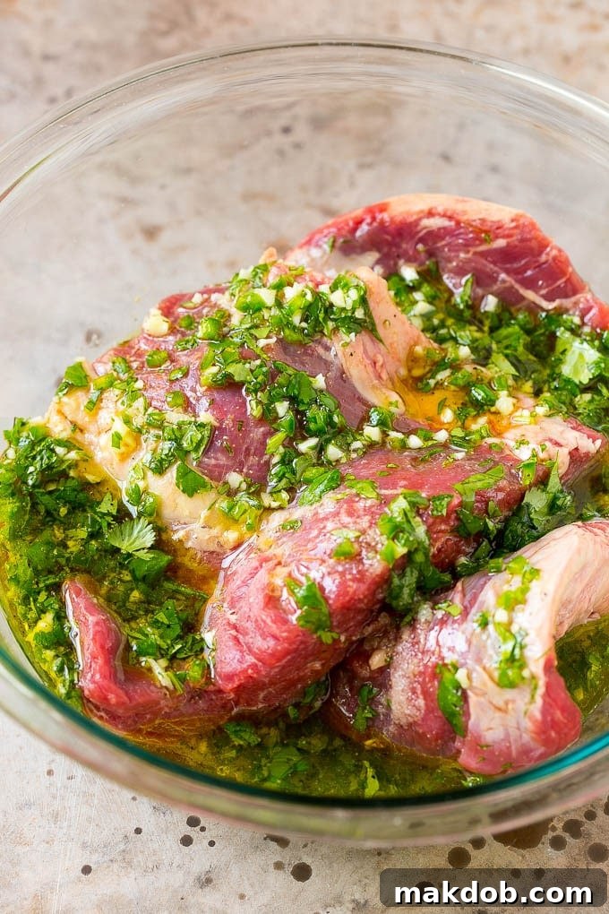 Sizzling Carne Asada Tacos 3 Marinated flank steak with citrus, cilantro, jalapeno, and olive oil, ready for grilling.