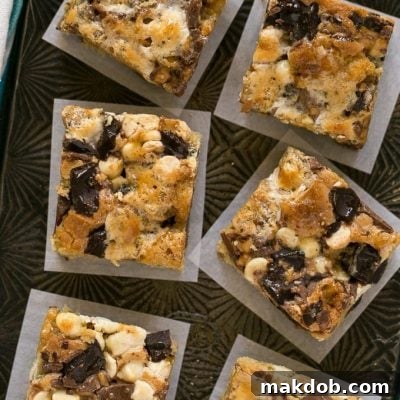 These Rocky Ledge Bars are the BEST cookie bar full of three kinds of chocolate, marshmallows and toffee.