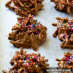 18 Effortless No-Bake Cookie Delights 15 Haystack cookies made with chow mein noodles on a baking sheet, showcasing their rustic texture.
