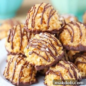 18 Effortless No-Bake Cookie Delights 19 A picture of a stack of no-bake salted caramel coconut macaroons, drizzled with chocolate.