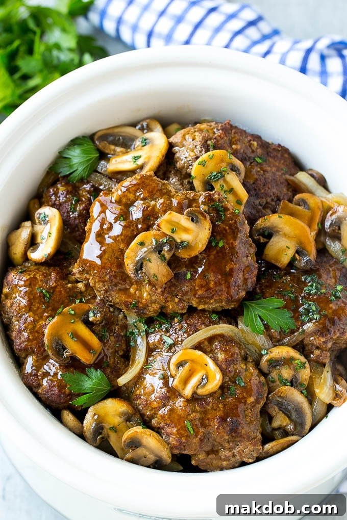 Slow Cooker Salisbury Steak Recipe | Homemade Salisbury Steak | Salisbury Steak from Scratch #steak #beef #salisbury #salisburysteak #slowcooker #crockpot #dinner #dinneratthezoo Slow cooker salisbury steak with mushroom, gravy and onions.
