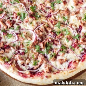 30 Creative Ways to Reinvent Leftover Turkey 22 An image of a pizza with turkey and barbecue sauce toppings.