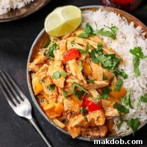 An image of a turkey curry in a bowl with rice.