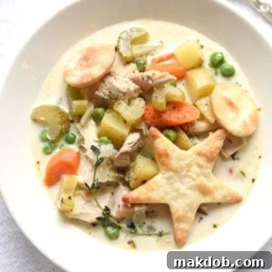 An image of turkey pot pie soup in a bowl.