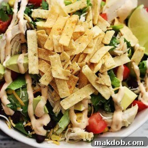 30 Creative Ways to Reinvent Leftover Turkey 33 An image of a taco salad made with turkey in a bowl.