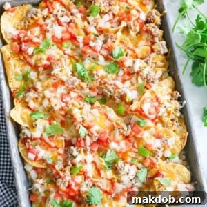 30 Creative Ways to Reinvent Leftover Turkey 7 An image of a tray of turkey meat nachos.