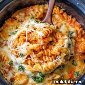 A picture of pizza pasta in a crock pot.