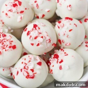 A bowl of delectable Peppermint Oreo Truffles, showcasing their smooth chocolate coating and festive peppermint crunch, perfect for a no-bake holiday treat.