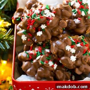 A charming holiday tin filled with a generous batch of homemade crock pot candy, ready for sharing.