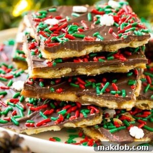 A festive platter piled high with Christmas crack, glistening with holiday sprinkles and ready to be devoured.