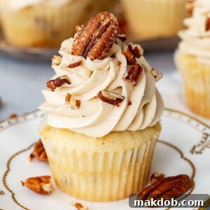 An image of a pecan pie flavored cupcake on a plate.