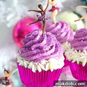 An image of a sugar plum fairy cupcake with purple frosting.