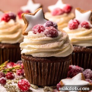 An image of a gingerbread cupcake with a star shaped gingerbread cookie on top.