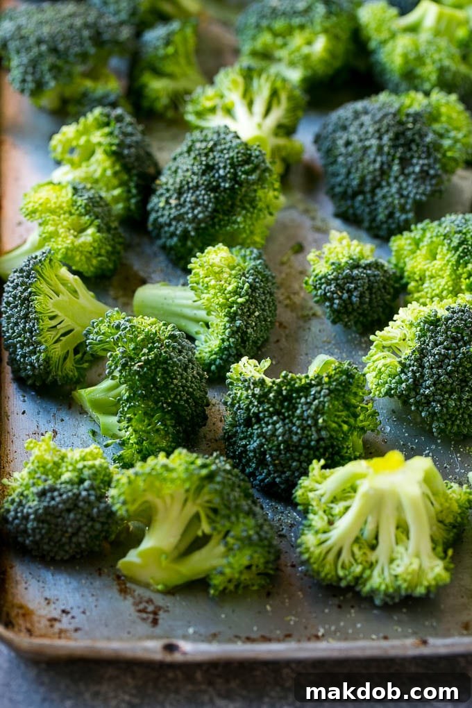 Parmesan roasted broccoli starts with fresh broccoli florets, olive oil, and a blend of seasonings for maximum flavor.