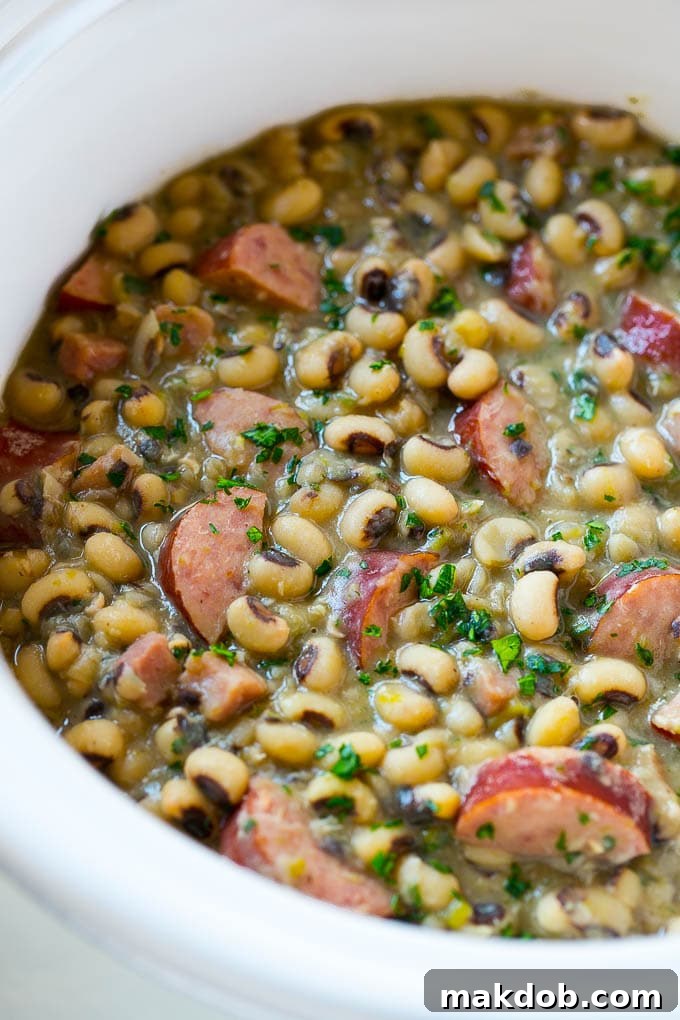 These crock pot black eyed peas with sausage and ham are the perfect meal for new years.