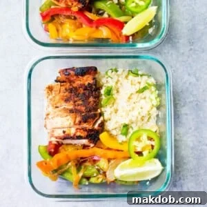 An image of a chipotle chicken fajita bowl neatly packed in a glass container for meal prep.