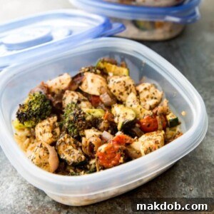 A picture of a container of Italian style chicken and mixed vegetables, ideal for meal prepping.