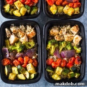 An image of containers filled with healthy roasted chicken and mixed veggie meals.