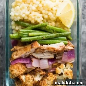 A vibrant image of couscous with succulent chicken and fresh veggies, ready for a Moroccan-inspired meal.