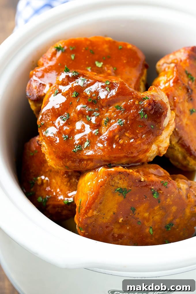 A slow cooker full of honey garlic pork chops.