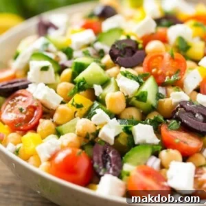 This recipe for chopped greek salad is a variety of fresh vegetables with chickpeas, creamy feta cheese and olives, all tossed in a greek lemon and herb vinaigrette.
