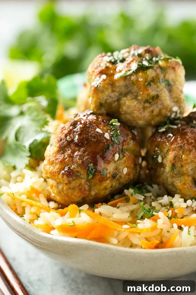 Aromatic Asian Meatballs and Carrot Rice 4 The process of making these Asian turkey meatballs involves mixing lean ground turkey with panko, fresh cilantro, soy sauce, garlic, and sriracha for a light and flavorful experience. These tender meatballs are then broiled to perfection.