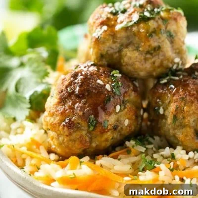 This recipe for Asian turkey meatballs involves light and tender meatballs that are seasoned with Asian flavors, tossed in a honey garlic sauce and served over a colorful carrot rice. It's a quick and easy weeknight meal that the whole family will love!