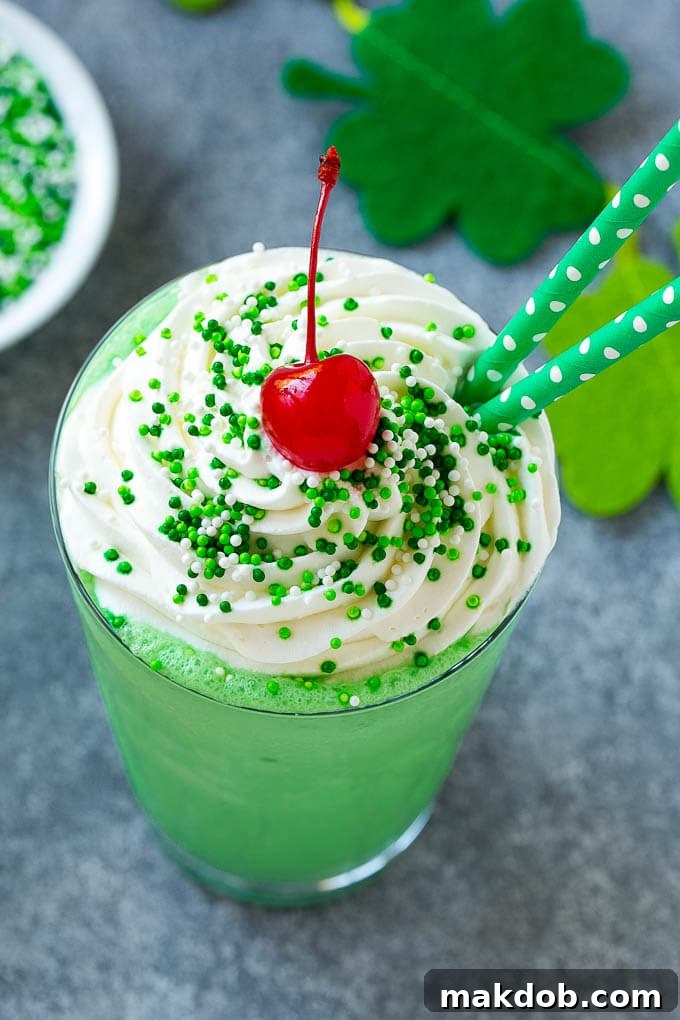 Whip Up Your Own Shamrock Shake 2 A mint Shamrock shake finished off with a swirl of whipped cream sprinkles and a cherry.