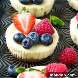 This recipe for Greek yogurt cheesecakes is mini cheesecakes that have been lightened up with Greek yogurt and topped with fresh berries. A quick and easy sweet treat! #CloverGreekYogurt ad