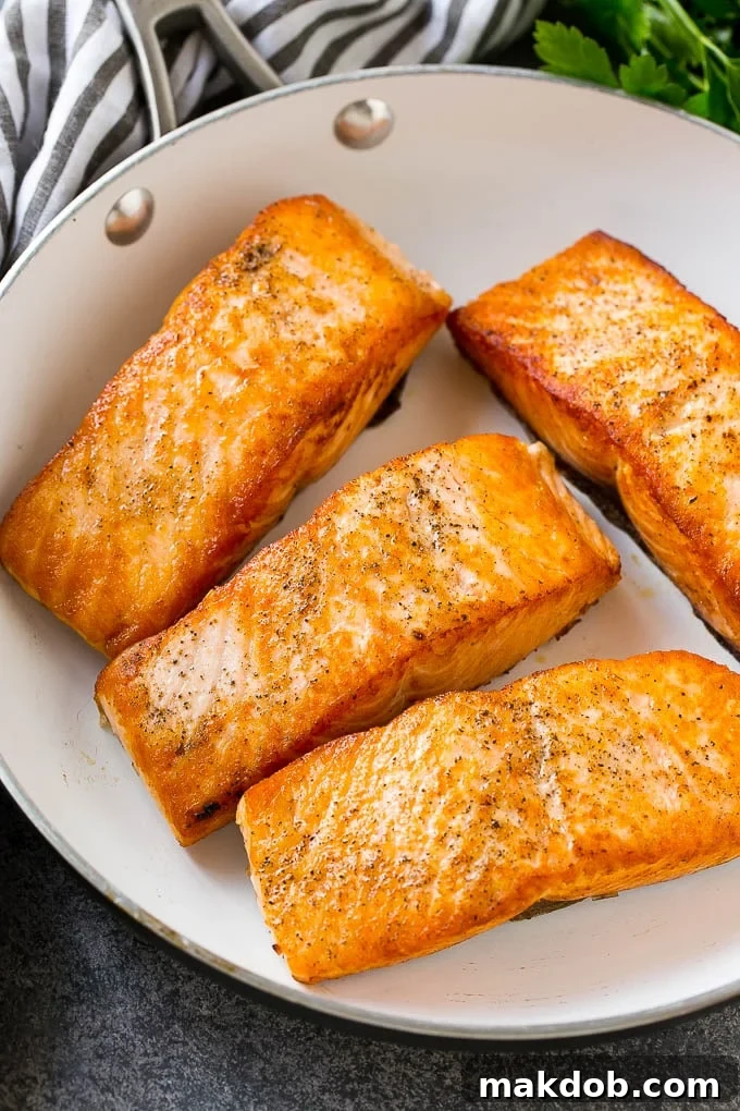 Honey Garlic Salmon Recipe | Asian Salmon Recipe | Healthy Salmon Recipe #salmon #fish #seafood #healthy #dinner #dinneratthezoo Seared salmon fillets in a frying pan.
