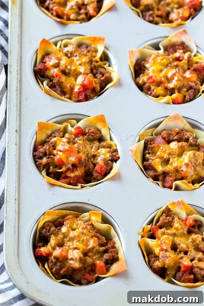 Taco Cups Recipe | Wonton Taco Cups | Taco Cupcakes | Mexican Appetizer #taco #hamburger #appetizer #dinneratthezoo #beef Taco cups baked in a muffin tin.