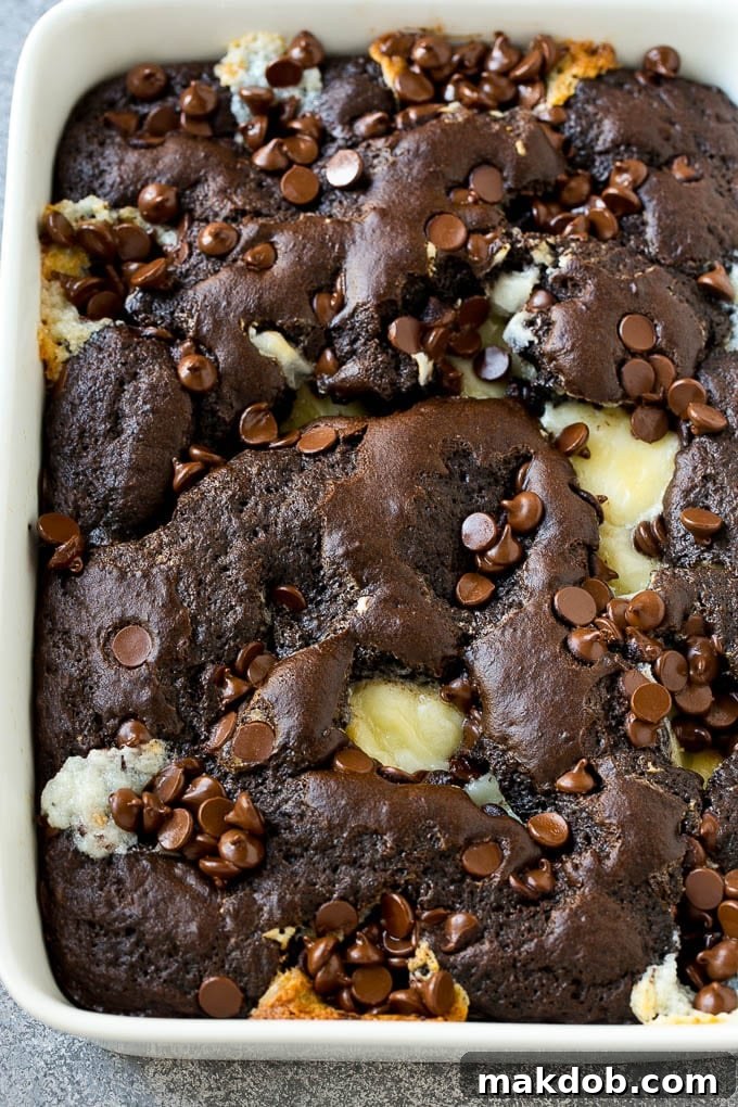 An overhead shot of chocolate cream cheese cake, showcasing its rich, gooey texture and unique 'earthquake' cracks.