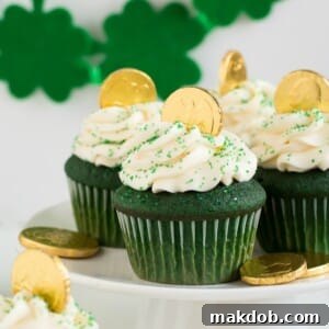 An image of several green velvet cupcakes on a platter.
