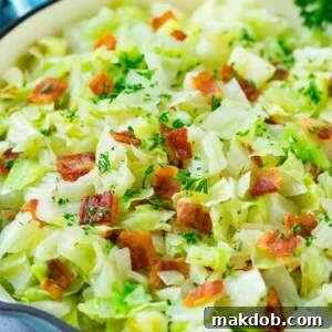 Fried cabbage with bacon, onions and parsley.
