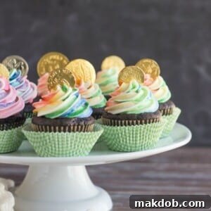 An image of several pot of gold cupcakes on a platter.