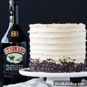 An image of a coffee Bailey's layer cake on a cake stand.