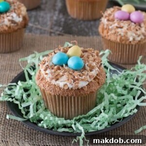 An image of a birds nest cupcake on a small plate.