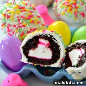 An image of delightful Peeps brownie bombs, coated in white chocolate and colorful sprinkles.