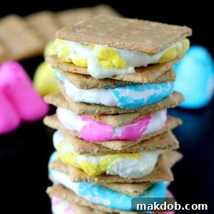 An image showing several s'mores creatively made with colorful Peeps marshmallows.