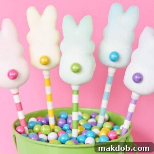 Sweet candy pops featuring Peeps dipped in a smooth white coating, perfect for Easter.