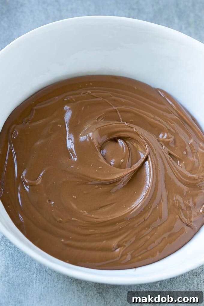 Birds Nest Cookies | Chow Mein Noodle Cookies | Easter Cookies | No Bake Cookies #cookies #easter #nobake #chocolate #dessert #dinneratthezoo Melted chocolate and butterscotch in a bowl, ready for chow mein noodles.