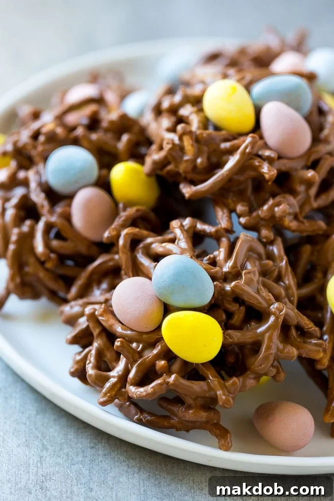 Birds Nest Cookies | Chow Mein Noodle Cookies | Easter Cookies | No Bake Cookies #cookies #easter #nobake #chocolate #dessert #dinneratthezoo A beautiful plate of finished birds nest cookies, perfect for an Easter dessert spread.