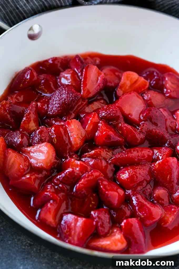 Strawberry Waffles | Homemade Waffles Recipe | Waffles with Strawberry Sauce | Homemade Strawberry Sauce #strawberry #waffles #breakfast #dinneratthezoo A pan of homemade fresh strawberry sauce simmering on the stove.