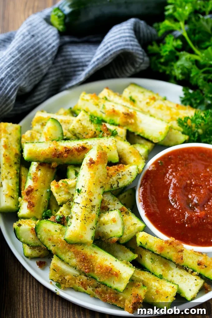 A plate of baked parmesan zucchini spears.