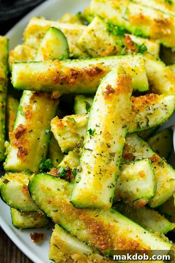 Zucchini sticks coated in parmesan, herbs and breadcrumbs.