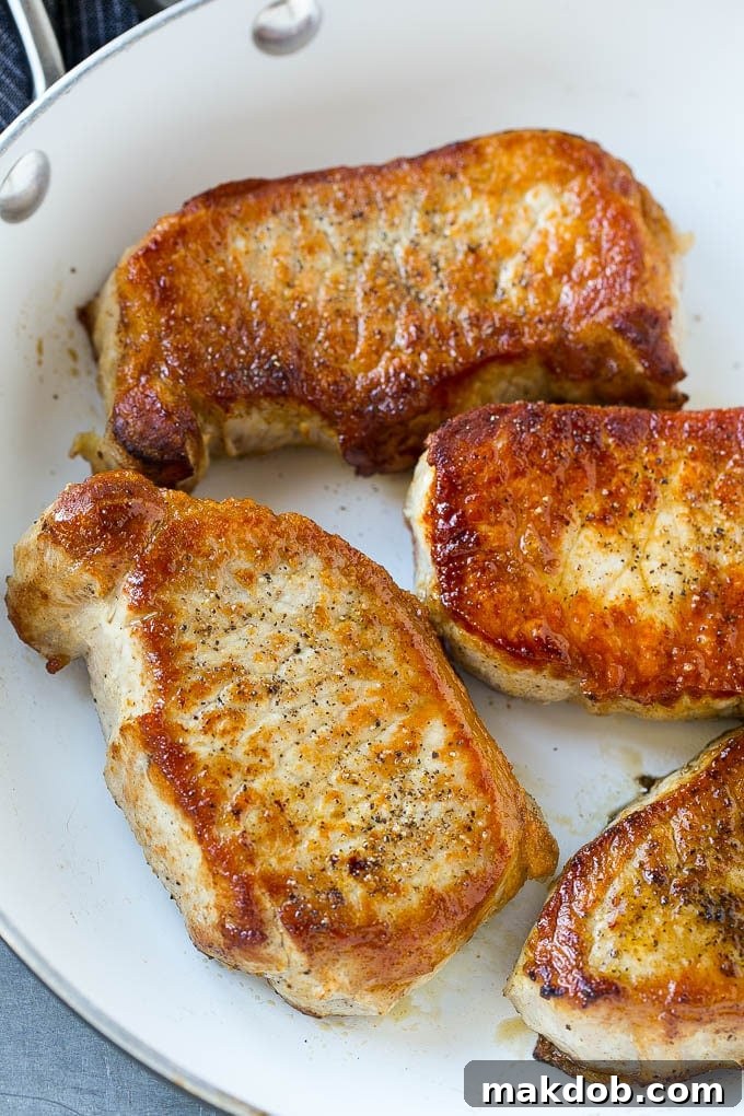 Mushroom Pork Chops Recipe | Boneless Pork Chop Recipe | Pork Chops with Mushroom Sauce #pork #porkchops #mushrooms #dinner #dinneratthezoo A skillet of seared boneless pork chops.