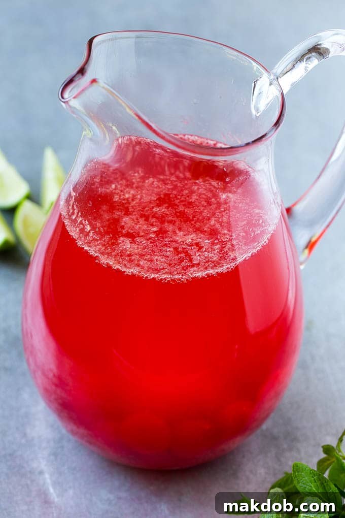 Soda, cherries, cherry juice and limeade in a pitcher. Soda, cherries, cherry juice and limeade in a pitcher.